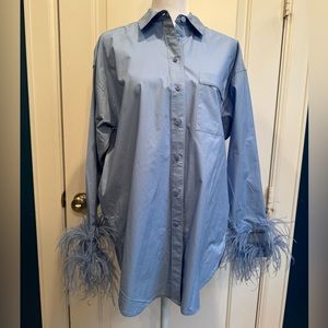 J. Crew blue cotton blouse with feather cuff trim. This is the longer style.